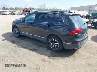 2021 Volkswagen Tiguan SE with VIN 3VV3B7AX3MM157702, listed as a IAAI auction lot 41888479 with 51,807 mi miles and . Bid and sale history available at DreamBid. Image 3.