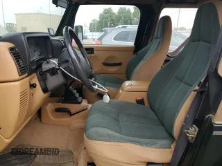 1998 Jeep Wrangler Sahara with VIN 1J4FY49S2WP707318, listed as a Copart auction lot 59508635 with 144,948 mi miles and Clean title. Bid and sale history available at DreamBid. Image 7.