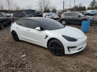 2022 Tesla Model 3 Long Range with VIN 5YJ3E1EB4NF164276, listed as a Copart auction lot 45802865 with 56,836 mi miles and Salvage Title. Bid and sale history available at DreamBid. Image 4.