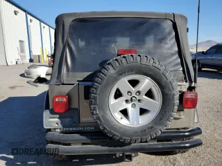 2003 Jeep Wrangler Sahara z VIN 1J4FA59S43P369233, wystawiony jako Copart lot #46517565 z przebiegiem 169 232 mil mil oraz Szkoda całkowita • Salvage title. Historia ofert i sprzedaży dostępna na DreamBid. Obrazek 6.