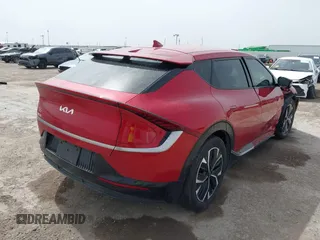 2022 Kia EV6 Wind z VIN KNDC3DLC6N5089018, wystawiony jako IAAI lot #41748175 z przebiegiem 25 157 mil mil oraz . Historia ofert i sprzedaży dostępna na DreamBid. Obrazek 4.