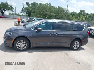 2023 Chrysler Pacifica Touring L with VIN 2C4RC1BG6PR590302, listed as a IAAI auction lot 42451369 with 72,097 mi miles and . Bid and sale history available at DreamBid. Image 14.