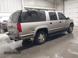 1999 GMC Suburban with VIN 3GKFK16R4XG541398, listed as a IAAI auction lot 41274339 with 243,827 mi miles. Bid and sale history available at carsss.com. Image 4.