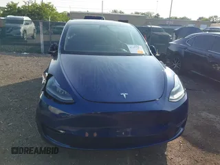 2023 Tesla Model Y Long Range with VIN 7SAYGDEE0PF671726, listed as a IAAI auction lot 42393616 with Not provided miles and . Bid and sale history available at DreamBid. Image 12.