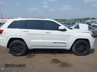 2020 Jeep Grand Cherokee Laredo E with VIN 1C4RJFAG5LC375033, listed as a IAAI auction lot 42415231 with 62,489 mi miles and . Bid and sale history available at DreamBid. Image 13.