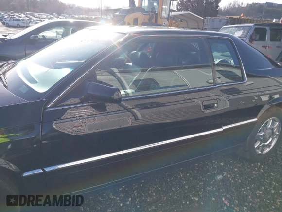 1999 Cadillac Eldorado Touring z VIN 1G6ET129XXU603042, wystawiony jako IAAI lot #41699955 z przebiegiem 81 704 mil mil oraz . Historia ofert i sprzedaży dostępna na DreamBid. Obrazek 15.