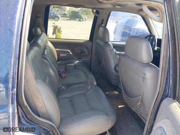 1999 Chevrolet Tahoe with VIN 1GNEC13R7XJ573387, listed as a IAAI auction lot 42001191 with 241,007 mi miles. Bid and sale history available at carsss.com. Image 8.
