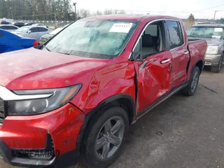 2022 Honda Ridgeline RTL-E with VIN 5FPYK3F74NB011358, listed as a IAAI auction lot 41431157 with 26,116 mi miles and . Bid and sale history available at DreamBid. Image 6.