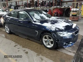 2015 BMW 4 Series 428i xDrive with VIN WBA4A7C57FD414955, listed as a IAAI auction lot 41609214 with 69,125 mi miles and . Bid and sale history available at DreamBid. Image 1.