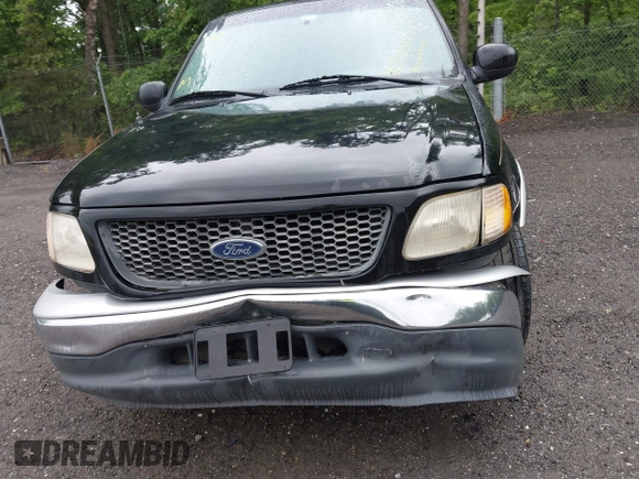 2000 Ford F-150 XL z VIN 1FTRX17L2YNB60131, wystawiony jako IAAI lot #42295537 z przebiegiem 216 638 mil mil oraz . Historia ofert i sprzedaży dostępna na DreamBid. Obrazek 12.