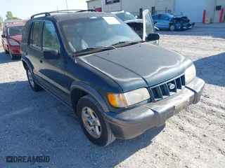 2002 Kia Sportage with VIN KNDJA723425144951, listed as a IAAI auction lot 42049262 with 149,793 mi miles. Bid and sale history available at carsss.com. Image 6.