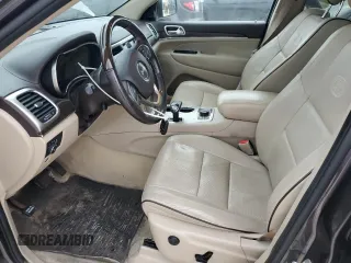 2014 Jeep Grand Cherokee Overland with VIN 1C4RJFCG9EC572237, listed as a Copart auction lot 53864865 with 90,657 mi miles and Salvage Title. Bid and sale history available at DreamBid. Image 7.