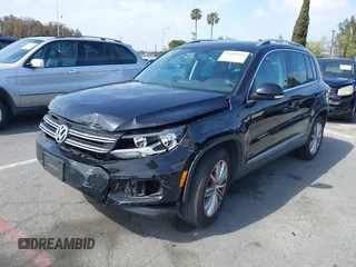 2015 Volkswagen Tiguan SE with VIN WVGAV7AX5FW509612, listed as a IAAI auction lot 42020599 with 64,201 mi miles and . Bid and sale history available at DreamBid. Image 2.