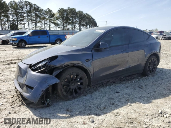 2023 Tesla Model Y Long Range z VIN 7SAYGAEE9PF662103, wystawiony jako Copart lot #51332105 z przebiegiem 35 294 mil mil oraz Szkoda całkowita • Salvage title. Historia ofert i sprzedaży dostępna na DreamBid. Obrazek 1.