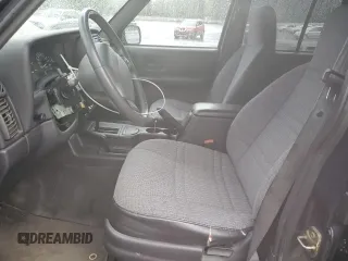 1999 Jeep Cherokee Sport with VIN 1J4FF68S6XL602177, listed as a Copart auction lot 51962355 with 176,386 mi miles and Salvage Title. Bid and sale history available at carsss.com. Image 7.