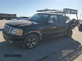 1999 Ford F-150 with VIN 2FTZX1729XCA25031, listed as a Copart auction lot 46941615 with 310,800 mi miles and Salvage title. Bid and sale history available at DreamBid. Image 1.