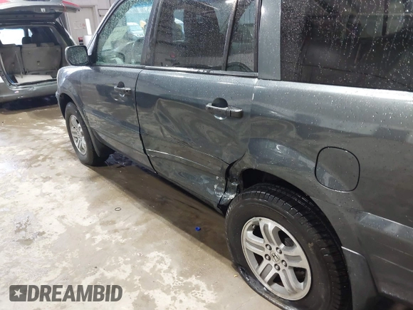 2005 Honda Pilot EX-L z VIN 2HKYF18715H564632, wystawiony jako IAAI lot #41685668 z przebiegiem 253 495 mil mil oraz . Historia ofert i sprzedaży dostępna na DreamBid. Obrazek 17.