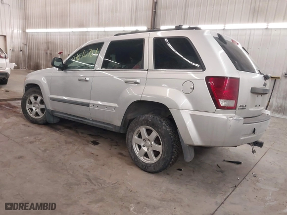 2009 Jeep Grand Cherokee Laredo with VIN 1J8GR48KX9C516873, listed as a IAAI auction lot 41610781 with 199,246 mi miles. Bid and sale history available at carsss.com. Image 3.
