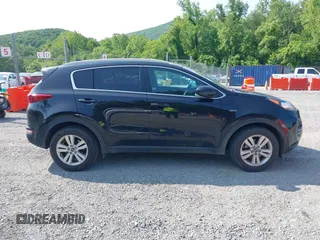 2017 Kia Sportage LX z VIN KNDPMCAC1H7285906, wystawiony jako IAAI lot #42399031 z przebiegiem 142 909 mil mil oraz . Historia ofert i sprzedaży dostępna na DreamBid. Obrazek 13.
