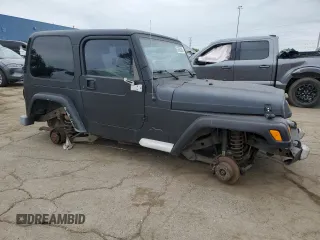 2002 Jeep Wrangler Sport z VIN 1J4FA49S22P763189, wystawiony jako Copart lot #57650295 z przebiegiem 197 383 mil mil oraz Czysty tytuł • Clean title. Historia ofert i sprzedaży dostępna na DreamBid. Obrazek 4.