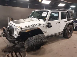 2017 Jeep Wrangler Unlimited Sport with VIN 1C4BJWDG9HL565213, listed as a IAAI auction lot 40999452 with 50,586 mi miles. Bid and sale history available at carsss.com. Image 2.