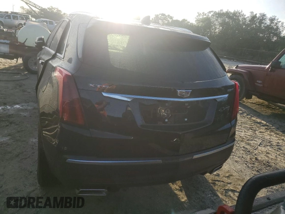 2022 Cadillac XT5 FWD Luxury z VIN 1GYKNAR49NZ159814, wystawiony jako Copart lot #74506584 z przebiegiem 7 069 mil mil oraz Nie do naprawy • Non repairable. Historia ofert i sprzedaży dostępna na DreamBid. Obrazek 6.