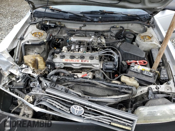 1991 Toyota Corolla z VIN 1NXAE94A8MZ234510, wystawiony jako Copart lot #75002404 z przebiegiem 188 051 mil mil oraz Szkoda całkowita • Salvage title. Historia ofert i sprzedaży dostępna na DreamBid. Obrazek 11.