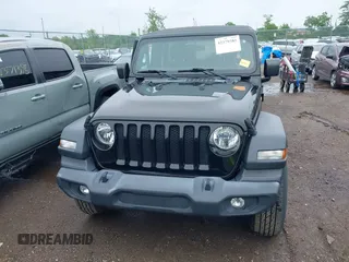 2018 Jeep Wrangler Unlimited Sport S with VIN 1C4HJXDG3JW150232, listed as a IAAI auction lot 42379385 with 60,679 mi miles and . Bid and sale history available at DreamBid. Image 12.