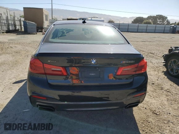 2019 BMW 5 Series M550i xDrive with VIN WBAJB9C50KB464503, listed as a Copart auction lot 56995825 with 67,324 mi miles and Salvage title. Bid and sale history available at DreamBid. Image 6.