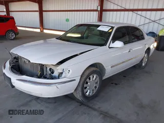 2000 Lincoln Continental with VIN 1LNHM97V9YY821894, listed as a IAAI auction lot 41657199 with 218,330 mi miles. Bid and sale history available at carsss.com. Image 2.