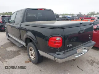 2003 Ford F-150 XLT with VIN 1FTRW07613KD14135, listed as a IAAI auction lot 41879756 with 197,515 mi miles. Bid and sale history available at carsss.com. Image 3.