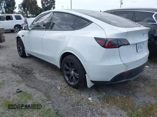 2024 Tesla Model Y with VIN 7SAYGDED2RF207783, listed as a IAAI auction lot 41758143 with Not Provided miles and . Bid and sale history available at DreamBid. Image 3.
