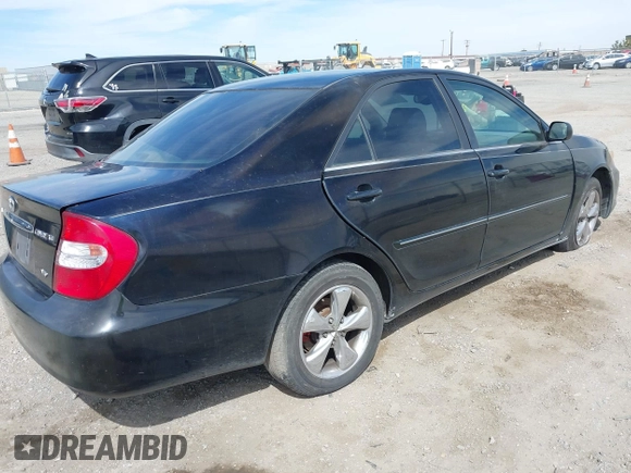 2003 Toyota Camry LE with VIN JTDBF32K730110278, listed as a IAAI auction lot 42033321 with 287,996 mi miles. Bid and sale history available at carsss.com. Image 4.