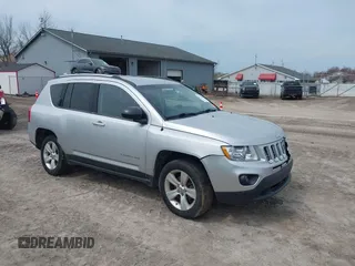 2012 Jeep Compass Sport with VIN 1C4NJDBB4CD624163, listed as a IAAI auction lot 42025783 with 148,928 mi miles. Bid and sale history available at carsss.com. Image 1.