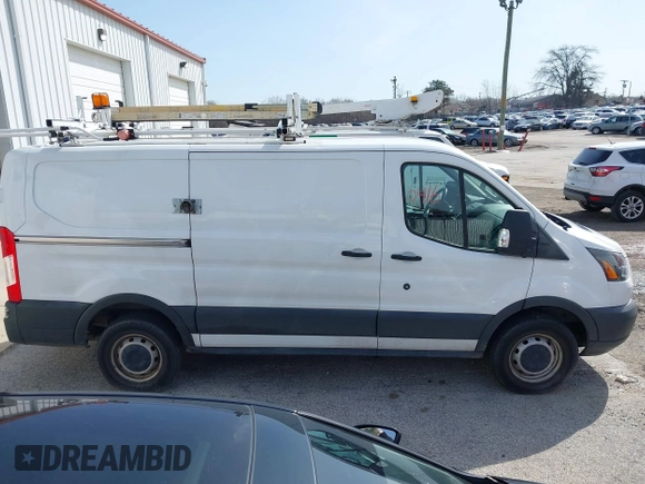 2016 Ford Transit Cargo z VIN 1FTYR1YM1GKB55452, wystawiony jako IAAI lot #41850416 z przebiegiem 91 973 mil mil oraz . Historia ofert i sprzedaży dostępna na DreamBid. Obrazek 13.