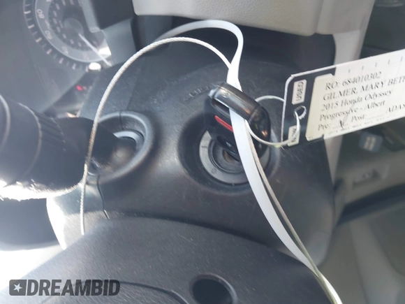 2015 Honda Odyssey LX with VIN 5FNRL5H29FB032327, listed as a IAAI auction lot 42052043 with 153,365 mi miles and . Bid and sale history available at DreamBid. Image 11.