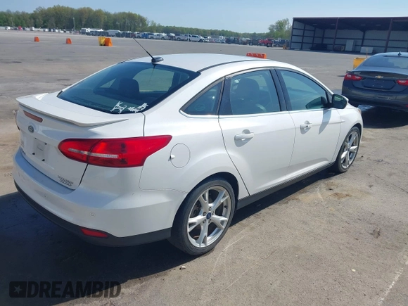 2016 Ford Focus Titanium z VIN 1FADP3J23GL358772, wystawiony jako IAAI lot #42103694 z przebiegiem 85 290 mil mil oraz . Historia ofert i sprzedaży dostępna na DreamBid. Obrazek 4.