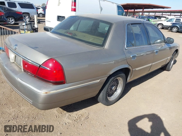 2002 Mercury Grand Marquis LS Premium z VIN 2MEFM75W32X636872, wystawiony jako IAAI lot #41717410 z przebiegiem 88 840 mil mil oraz . Historia ofert i sprzedaży dostępna na DreamBid. Obrazek 4.