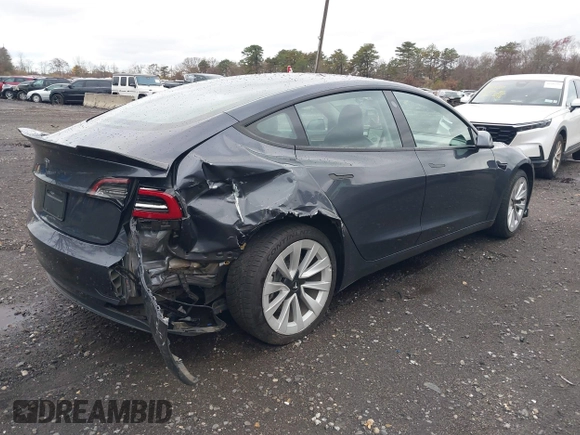 2022 Tesla Model 3 with VIN 5YJ3E1EA6NF143839, listed as a IAAI auction lot 40905007 with 83,897 mi miles and . Bid and sale history available at DreamBid. Image 4.