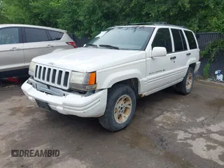 1997 Jeep Grand Cherokee Limited z VIN 1J4GZ78S1VC536295, wystawiony jako IAAI lot #42435292 z przebiegiem 310 005 mil mil oraz . Historia ofert i sprzedaży dostępna na DreamBid. Obrazek 2.