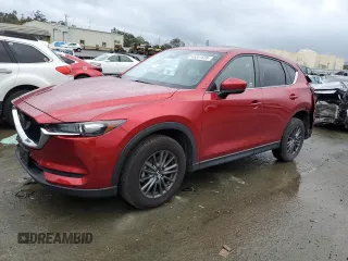 2021 Mazda CX-5 Touring with VIN JM3KFACM8M0406987, listed as a Copart auction lot 45241535 with 57,673 mi miles and Salvage Title. Bid and sale history available at carsss.com. Image 1.