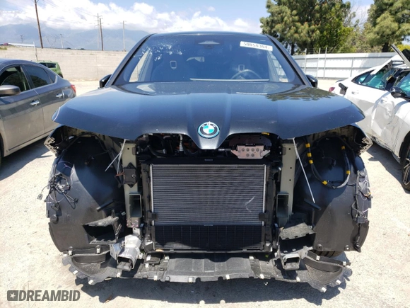 2024 BMW iX xDrive50 with VIN WB523CF05RCN96948, listed as a Copart auction lot 50858304 with 8,923 mi miles and Salvage Title. Bid and sale history available at carsss.com. Image 5.