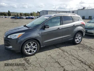 2015 Ford Escape Titanium with VIN 1FMCU0J98FUA46879, listed as a Copart auction lot 51173555 with 72,093 mi miles and Salvage Title. Bid and sale history available at DreamBid. Image 1.