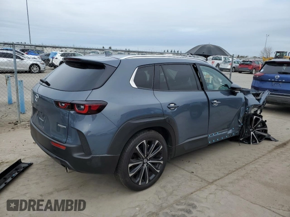 2023 Mazda CX-50 S Premium Plus with VIN 7MMVABEM7PN101642, listed as a Copart auction lot 47498675 with 12,299 mi miles and Salvage Title. Bid and sale history available at DreamBid. Image 3.