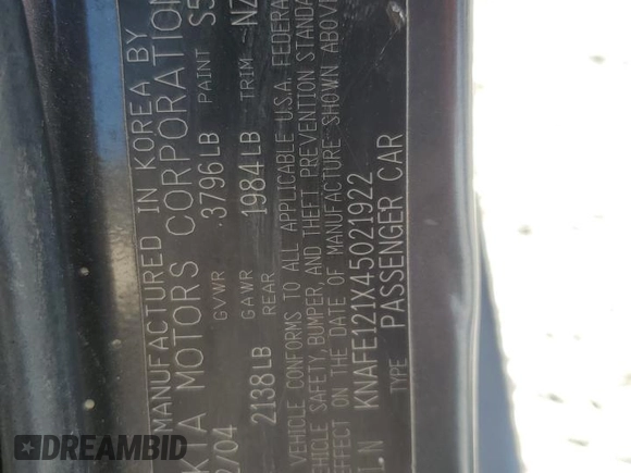 2004 Kia Spectra LX with VIN KNAFE121X45021922, listed as a Copart auction lot 49989845 with 184,189 mi miles and Salvage Title. Bid and sale history available at carsss.com. Image 14.