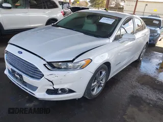 2016 Ford Fusion Titanium Hybrid with VIN 3FA6P0RU1GR191813, listed as a IAAI auction lot 41560954 with 86,922 mi miles. Bid and sale history available at carsss.com. Image 2.