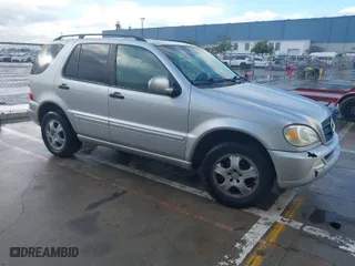 2002 Mercedes-Benz M-Class with VIN 4JGAB54EX2A358989, listed as a IAAI auction lot 41741848 with 181,697 mi miles. Bid and sale history available at carsss.com. Image 1.