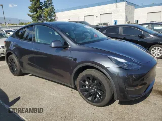 2024 Tesla Model Y with VIN 7SAYGDED7RF056973, listed as a Copart auction lot 55310705 with 15,391 mi miles and Salvage Title. Bid and sale history available at DreamBid. Image 4.