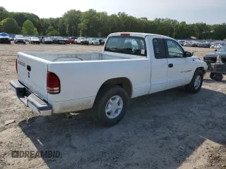 2001 Dodge Dakota z VIN 1B7GL22X21S128774, wystawiony jako Copart lot #58313685 z przebiegiem 167 355 mil mil oraz Czysty tytuł • Clean title. Historia ofert i sprzedaży dostępna na DreamBid. Obrazek 3.