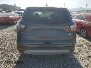 2017 Ford Escape SE z VIN 1FMCU0GD3HUF08778, wystawiony jako Copart lot #58224765 z przebiegiem 67 211 mil mil oraz Szkoda całkowita • Salvage title. Historia ofert i sprzedaży dostępna na DreamBid. Obrazek 6.